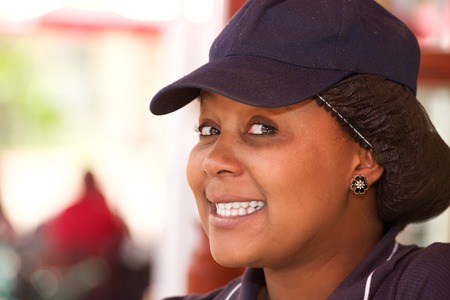 Cheerful beauty seller woman portrait in uniformの写真素材