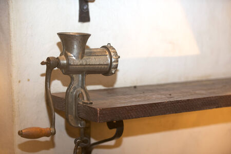 Old style meat mincer machine indoorの写真素材