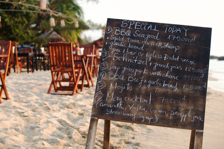 Restaurant menu board on the tropical beach in Asiaの写真素材