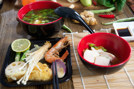 Traditional Japanese soup miso with vegetable and seafood tempuraの写真素材