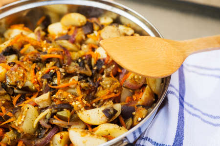 Healthy food: vegetable stew of potatoes, eggplant, onion, garlic, lemon and ginger.の写真素材