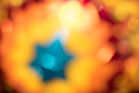 Light in colored glasses of decorative oriental lamps, blurred background