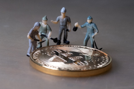 Workers repair Bitcoin coin