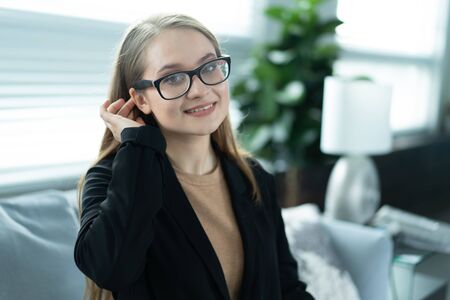 Portrait of manager girl in office interiorの写真素材