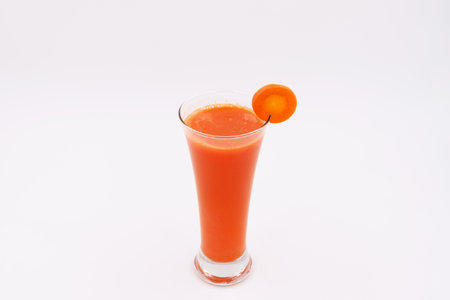 Carrot juice on a white backgroundの写真素材