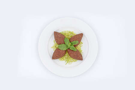 Lebanese stuffed kibbeh with mint leaves on topの写真素材