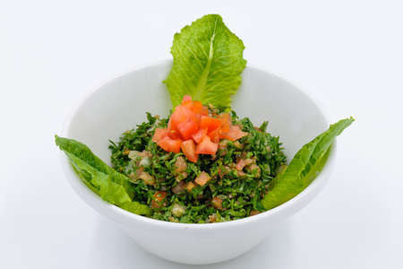 Lebanese traditional salad tabbouleh in a white bowlの写真素材