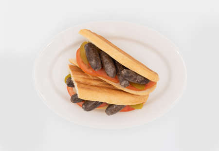 Oriental sausage sandwich with tomato and picklesの写真素材