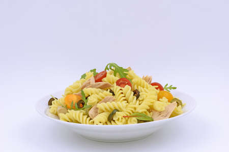 Tuna pasta salad with colored cherry tomatoの写真素材