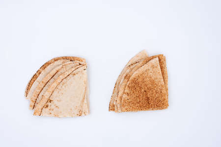 Lebanese bread cut in half on white backgroundの写真素材