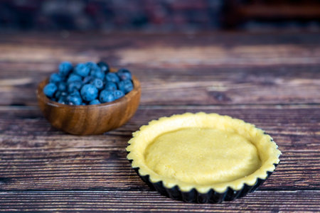 Delicious Blue berry tart or pie large  on wood table background.の写真素材