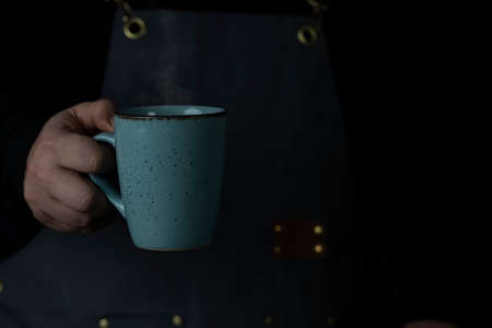 Man Hand holding cup,in his Break.の写真素材
