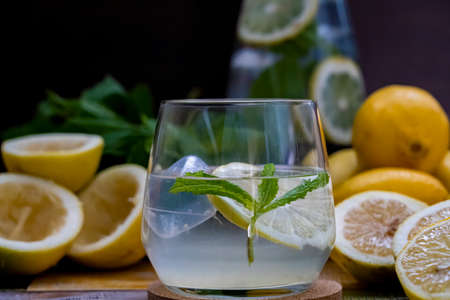 Mojito cocktail, Refreshing summer cocktail with lemon and lime, mint lemonade in a glass and bottle.の写真素材