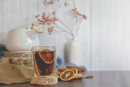 Tea with autumn decor,  pumpkins,dry  Orange slices and cinnamon on table and white  background. Concept of Thanksgiving , Autumn, tea,herbal tea .の写真素材