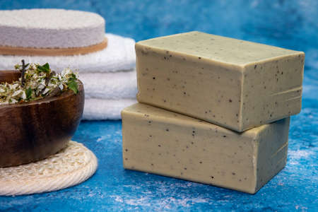 Aleppo soap and dray Laurus nobilis flower in a wooden plate .の写真素材