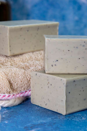 Aleppo soap and dray Laurus nobilis flower in a wooden plate .
