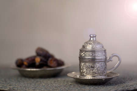 Silver coffee cup and Dates.の写真素材