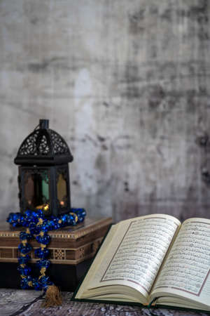 Ramadan lantern and lit up and the Holy Quran book.の写真素材