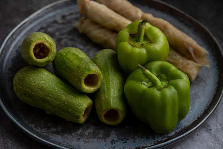 Different types of Mahashi or Dolma, cabbage rolls, stuffed peppers,Stuffed Zucchini, row before cooking.の写真素材