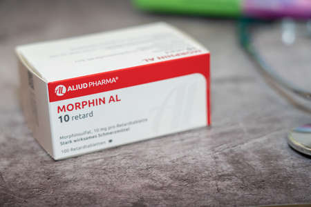 Drug box of  Morphine,pain medication of the opiate.On a table and in the background different...