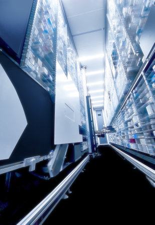 A robot hand  arranging and storing out drugs in a pharmacy.のeditorial素材