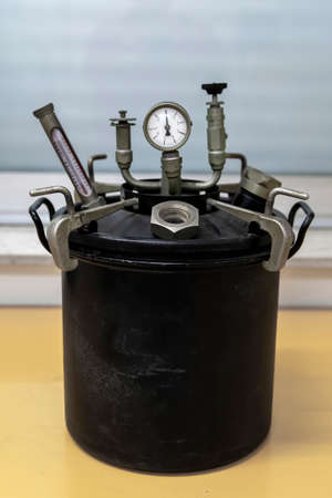 Old labor pharmaceutical autoclave, machine used to carry out industrial and scientific processes requiring elevated temperature and pressure .の写真素材