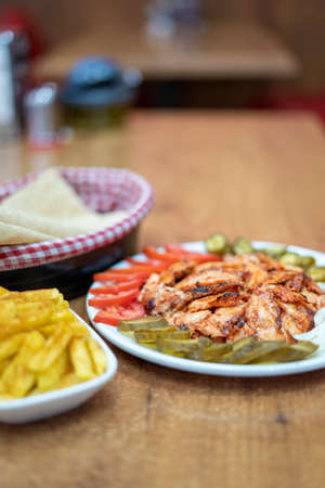Chicken dÃ¶ner meat plate in a Restaurant