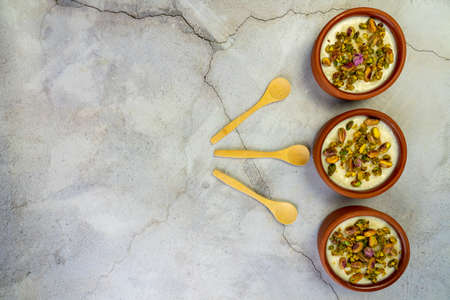 Milk Rice in pottery bowl flat lay, copy space.