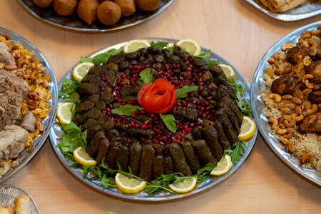 Stuffed grape leaves of the grapevine plant stuffed with a mixture of rice, meat, and spices.