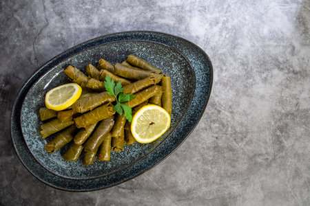 Grape leaves with parsley and lemons called Dolma , made from vines with rice, meat and...