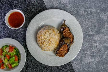 KarnÄ±yarÄ±k dish found in Turkish cuisine consisting of eggplant stuffed with a mix of  chopped onions, tomatoes,  parsley and ground meat.Top viewの写真素材