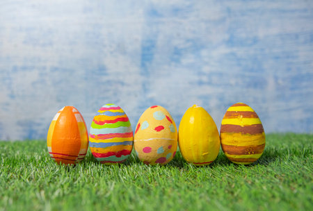 Easter eggs colored on grass dreamy effect side view