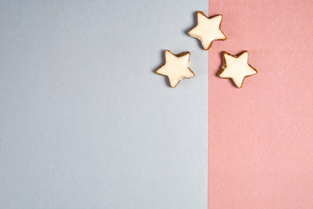 cinnamon star cookie on a pastel colored background. writing space or copy space.Christmas concept