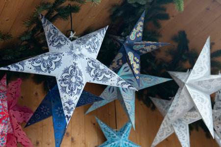 Paper Christmas stars colored with different patterns