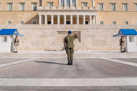 Guard at the Monument of the Unknown Soldier  at Syntagma Square the Greek HELLENIC Parliament that is the central square of Athens.のeditorial素材
