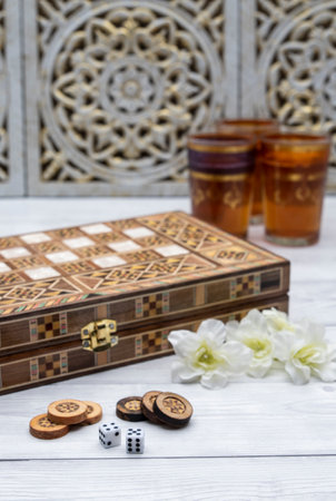 Oldest known board games Backgammon with cups of tee.