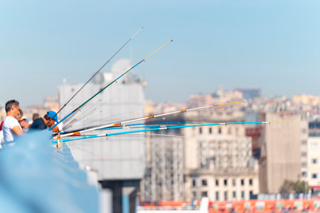 Fisherman fishing at Galata Bridge Galata KÃ¶prÃ¼sÃ¼, daily crowded bridge side with many fisherman.のeditorial素材