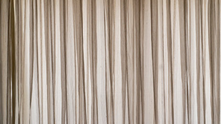 Hanging window curtain as backgroundの写真素材