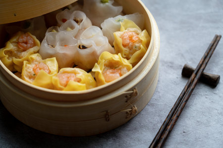 Dim Sum mix steamed in bamboo  wood basket.large range of small Chinese dishes that are traditionally enjoyed in restaurants for brunchの素材 [FY310197160293]