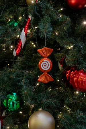 Red bombong Christmas decoration and ornaments hang on christmas tree.の写真素材