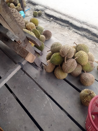 Durian fruit on the wood table in the market, Thailand.