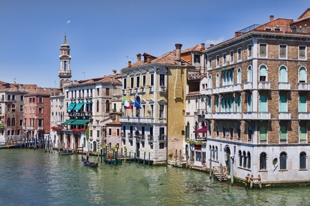 View on Grand Canal buildings and gondolas on the mirror surface of water from the ancient Rialto bridge in Veniceのeditorial素材