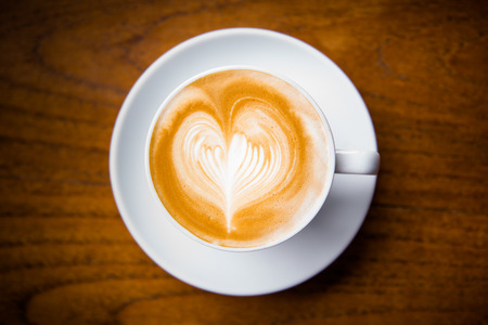 a cup of hot coffee , cappuccino heart designの写真素材