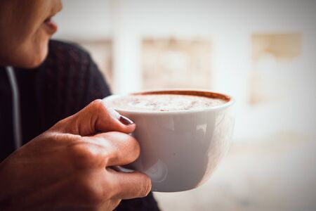 woman relaxing with coffee at homeの写真素材