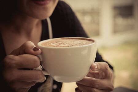 woman relaxing with coffee at homeの写真素材