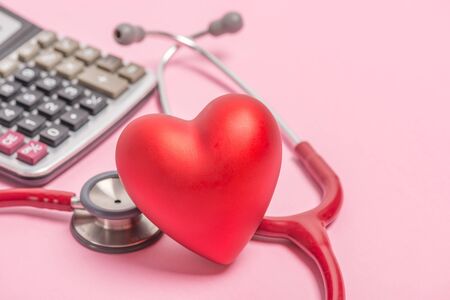 Stethoscope and red heart on pink backgroundの写真素材