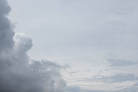dark gray sky with large clouds before rainingの写真素材