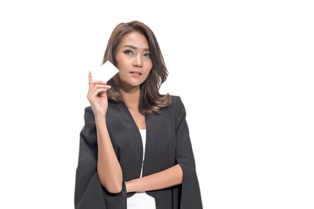young dreaming business woman holding empty credit cardの写真素材
