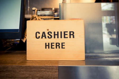 Cashier at checkout counterの写真素材
