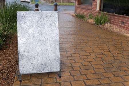 blank metal advertising in  front of restaurantの写真素材